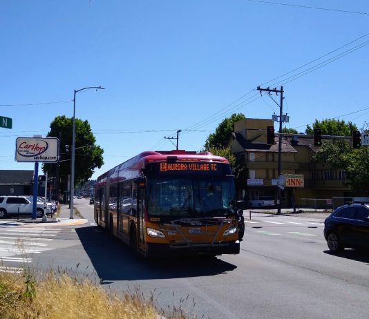 24/7 Aurora Bus Lanes to Keep Riders Moving During I-5 Overhaul An E Line bus heads northbound on Aurora Avenue N near Green Lake on a sunny day.