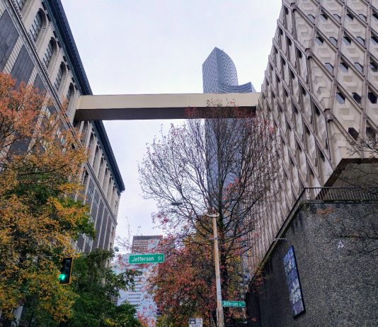 King County Council Gets On Board with Civic Campus Redevelopment A view up at the skybridge between the King County Admin Building and the King County Courthouse, with Columbia Tower in the background