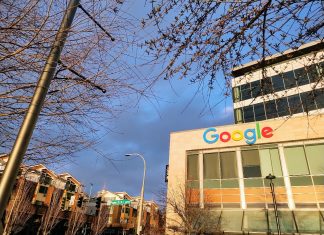Kirkland Council Elections Could Tip City in Reactionary Direction Google's logo is illuminated in the sun at the Kirkland Urban building in Downtown Kirkland. A row of townhouses sits behind.