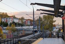 Link Light Rail Smashes Ridership Record in October A train pulls into Mount Baker station with the downtown Seattle skyline in the distance.