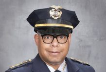 Harrell Taps Top Madison Cop for Chief, Fires Diaz for Lying Barnes is a black man with glasses pictured posing in a police uniform.