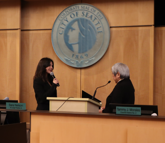 Alexis Mercedes Rinck Takes Office, Pledging Seattle Will Resist Trumpism The pair stand before the Seattle city seal at Seattle City Council chambers.