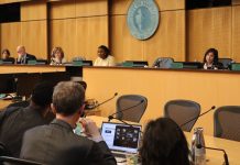 Moore Leads Housing Backlash in Seattle Council’s First Comprehensive Plan Meeting In the foreground are OPCD planners and in the background are city councilmembers at the dais.