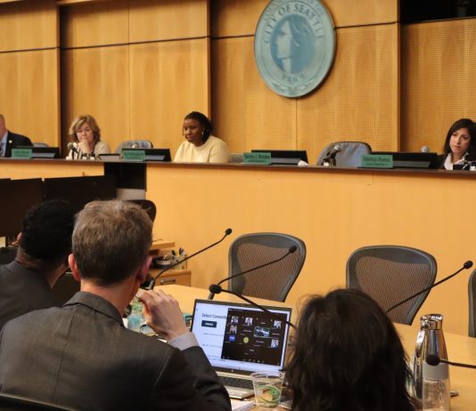 Moore Leads Housing Backlash in Seattle Council’s First Comprehensive Plan Meeting In the foreground are OPCD planners and in the background are city councilmembers at the dais.