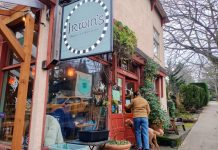 Neighborhood Cafe and Corner Store Bill Fails for Third Straight Year A patron grips the front door at Irwin's neighborhood cafe in leafy Wallingford. Customers fill the window seats inside.