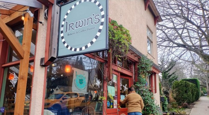 Neighborhood Cafe and Corner Store Bill Fails for Third Straight Year A patron grips the front door at Irwin's neighborhood cafe in leafy Wallingford. Customers fill the window seats inside.