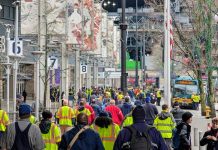 Transit Workers Demand Safety Fixes as They Mourn Shawn Yim A bus has Shawn Yim on its display.
