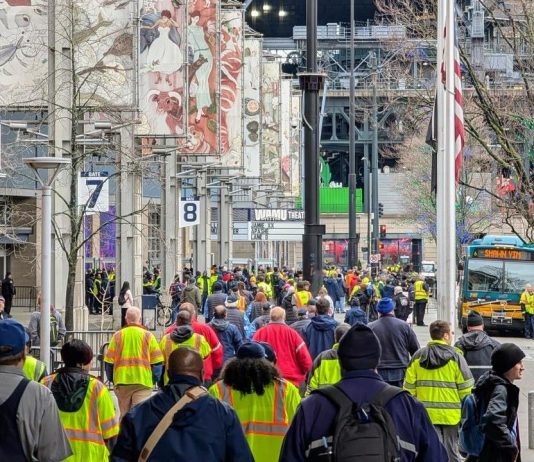 Transit Workers Demand Safety Fixes as They Mourn Shawn Yim A bus has Shawn Yim on its display.