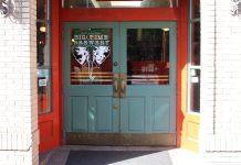 Join The Urbanist for Our February Social Events Big Time is an orange building and a turquoise door.