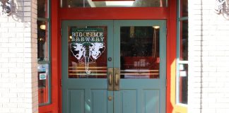 Join The Urbanist for Our February Social Events Big Time is an orange building and a turquoise door.