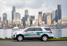 State Bill Would Circumvent SPOG, Clear Path for Seattle Civilian Responder Expansion A CARE department SUV parks on the Elliott Bay waterfront with the skyscraper of the Seattle skyline in the background.