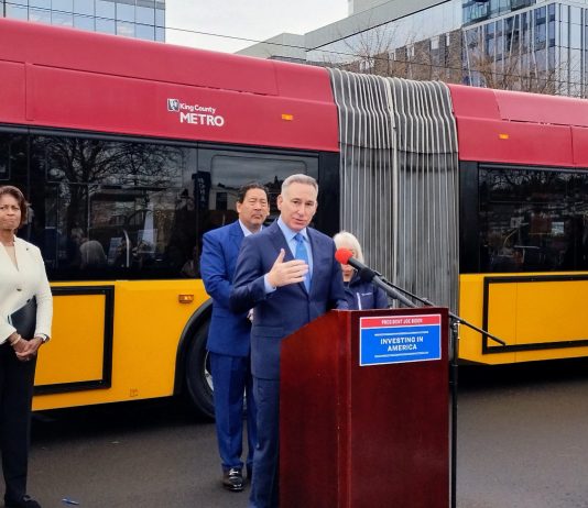 Dow Constantine Reveals Sound Transit CEO Bid Dow Constantine at a podium with Bruce Harrell behind
