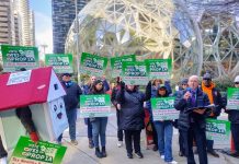 Social Housing Proposition 1A Prevails, Gains 20-Point Lead in Thursday Count A house mascot and a dozen sign wielding advocates standing in front of the glass spheres.