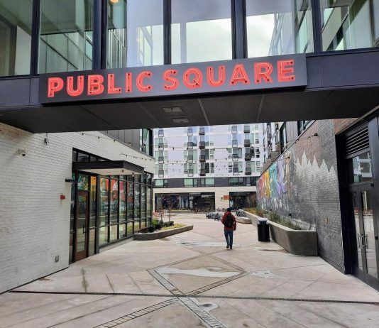 Seattle Awards $22 Million in Equitable Development Grants Aimed to Combating Displacement An alley leads into the interior public square of the Midtown Square complex.