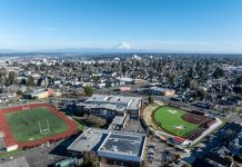 Op-Ed: Students Advocate for Carpooling Incentives at High School Parking Lots An aerial shot of North Tacoma neighborhoods with Mount Rainier and the Tacoma Dome in the distance.