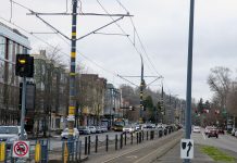 Sound Transit Selects Design Approach for Graham Street Infill Station Light rail tracks run down the median of MLK Way in Columbia City station with new four story buildings on either side.