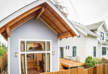 Snohomish County Relaxes Urban Accessory Dwelling Rules Ahead of State Deadlines A small cottage with its doors open, revealing living room, behind a larger parent house