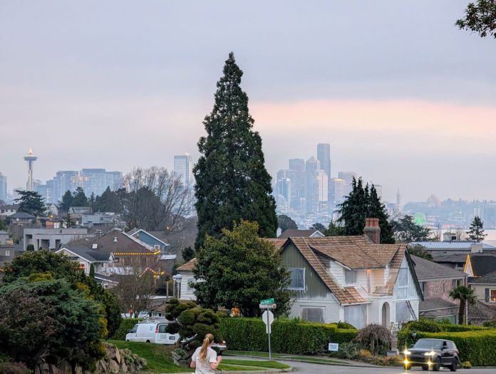 Magnolia Boulevard with the Seattle skyline and a thin layer of fog in the distance.