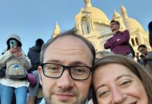 Why I Support The Urbanist Jesse and his spouse pose in front of a basilica in Mexico City.
