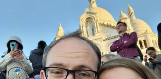 Why I Support The Urbanist Jesse and his spouse pose in front of a basilica in Mexico City.