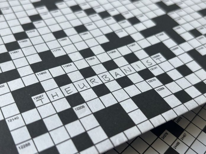 A crossword puzzle with The Urbanist written in for one of the answers.