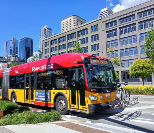 King County Floats Sales Tax Bump to Fund Metro, Roads A red RapidRide bus on the Seattle waterfront