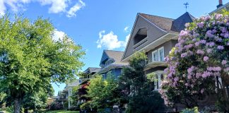 A large home in North Capitol Hill with a sloping front lawn
