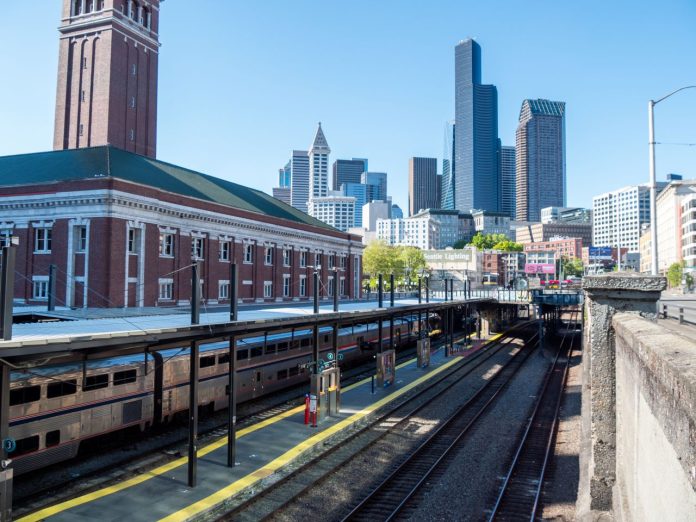 AMTRAK King Street Station by Juan Jocom King Street Station with the downtown Seattle skyline in the background on a clear sunny day.