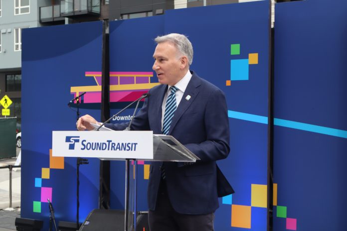 Dow Constantine Dow Constantine at a podium