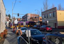 Op-Ed: Expand Urbanism, Emphasize Inclusion and Equity in Our Shared Vision A bus on Rainier Avenue passes by as a pedestrian walks up the side street in Columbia City.
