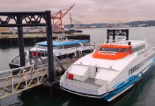 Bremerton Fast Ferry Faces Saturday Service Cut This Fall A Kitsap Transit fast ferry sits at the dock at Pier 50 with a King County Water Taxi