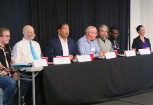 Seattle Mayoral Hopefuls Sound Off on Transportation, Housing The candidates sit at table with name tags in front.