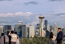 Seattle’s Population Blows Past 800,000 in Latest State Estimates A group of young people stand by the railing at Kerry Point with the Space Needle and downtown skyscrapers looming in the distance.