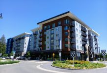 Sammamish Council Pursues Denser Town Center Vision Amid Backlash A six story apartment building in Sammamish next to a roundabout