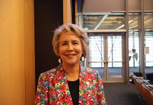 Seattle Council Appoints Debora Juarez to Fill District 5 Vacancy A native woman with grey hair wearing a loud, floral print suit