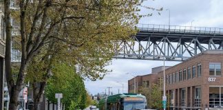 The view east up N 34th Street with the steel-spanned Aurora Avenue bridge in the distance.