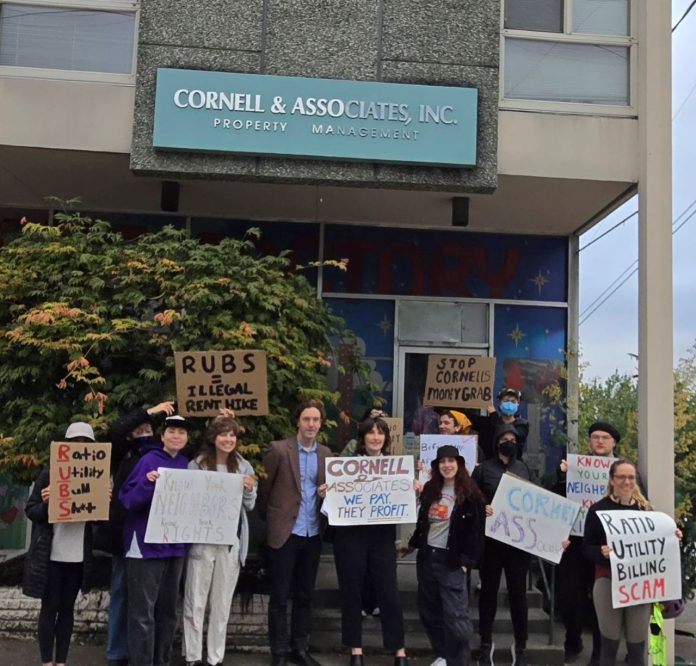 Tenants rally against RUBS - 20250620 lexy salas Tenants hold signs criticizing RUBS in front of Cornell and Associates office
