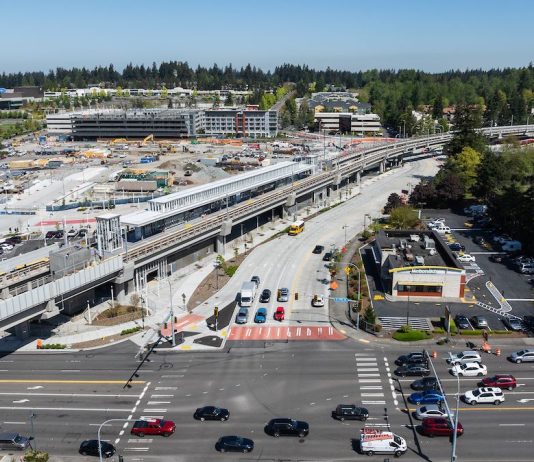 Federal Way Link Stations Not Seeing a Housing Boom An aerial image shows an elevated light rail station next to a big staging area and a busy collector road.