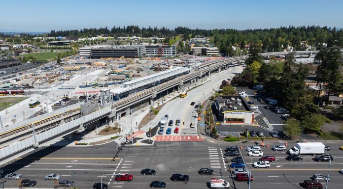Federal Way Link Stations Not Seeing a Housing Boom An aerial image shows an elevated light rail station next to a big staging area and a busy collector road.