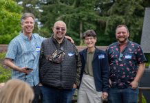 Progressives Well-Positioned for Burien Council Takeover The four candidate stand in a line smiling with trees in the background.
