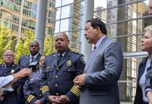 Federal Judge Ends Consent Decree Oversight of Seattle Police Department Officials stand on the steps of Seattle's US Courthouse after the consent decree hearing.