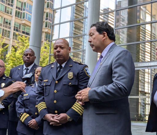 Federal Judge Ends Consent Decree Oversight of Seattle Police Department Officials stand on the steps of Seattle's US Courthouse after the consent decree hearing.