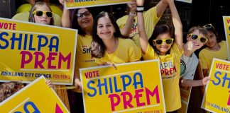 Op-Ed: Shilpa Prem Is the Best Choice for Kirkland Council Prem and young supporters pose with yellow campaign shirts and yard signs.