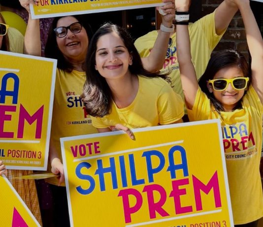 Op-Ed: Shilpa Prem Is the Best Choice for Kirkland Council Prem and young supporters pose with yellow campaign shirts and yard signs.