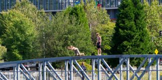 Seattle Street Ends: South Lake Union two guys jumping off the top of the ped bridge