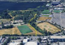 Op-Ed: UW’s Union Bay Hypocrisy: Public Land, Private Fence An aerial image shows a yellow line demarcating the trail route through the play fields to the nature area along Union Bay.