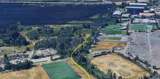 Op-Ed: UW’s Union Bay Hypocrisy: Public Land, Private Fence An aerial image shows a yellow line demarcating the trail route through the play fields to the nature area along Union Bay.