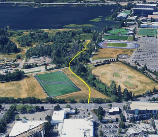 Op-Ed: UW’s Union Bay Hypocrisy: Public Land, Private Fence An aerial image shows a yellow line demarcating the trail route through the play fields to the nature area along Union Bay.