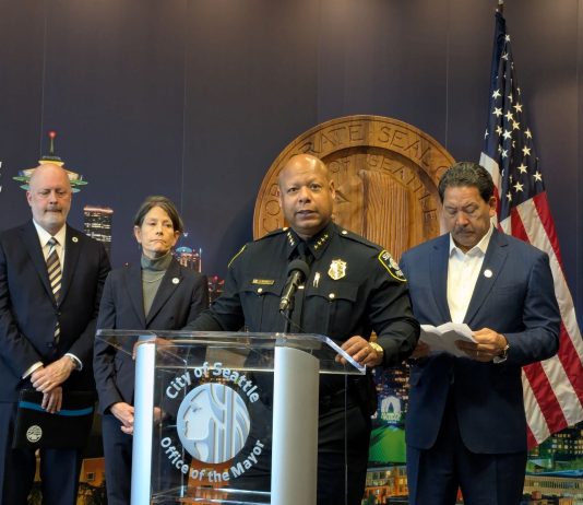 Harrell and SPOG Rush Police Contract, Hamstringing Civilian Responders, Accountability Agencies Barnes standard at the lectern with the City seal behind.