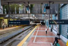 Sound Transit CEO Lays Out Approach to Second Seattle Rail Tunnel A view of the platform at International District Station from partway up the escalator. A few dozens passengers are waiting for trains.
